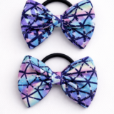 Kids bow hair tie with a lavender bow made from soft lycra fabric