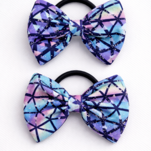 Kids bow hair tie with a lavender bow made from soft lycra fabric