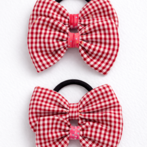 Kids bow hair tie with a red gingham cotton bow attached to a hair elastic
